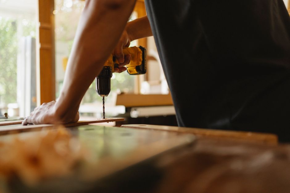 Carpenter installing wooden door